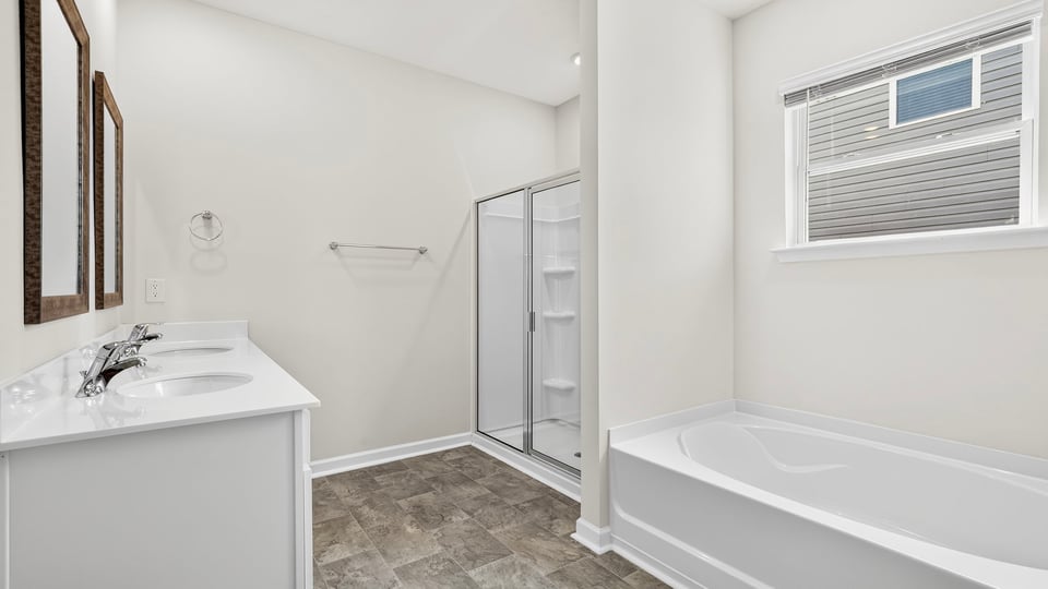 Primary bathroom with double vanity sinks.