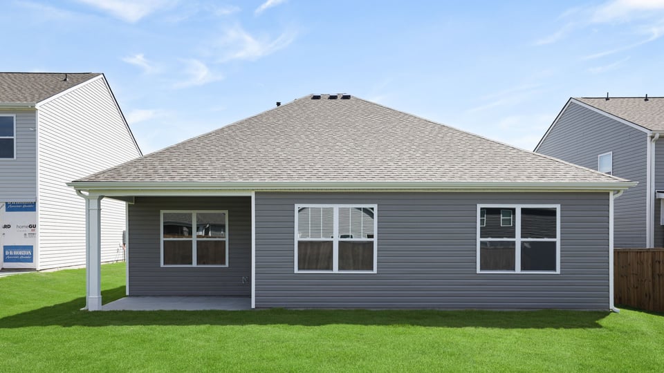Back exterior with large backyard.