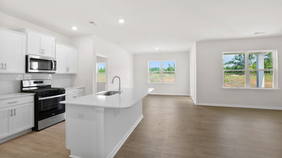 Kitchen with island and cabinets.