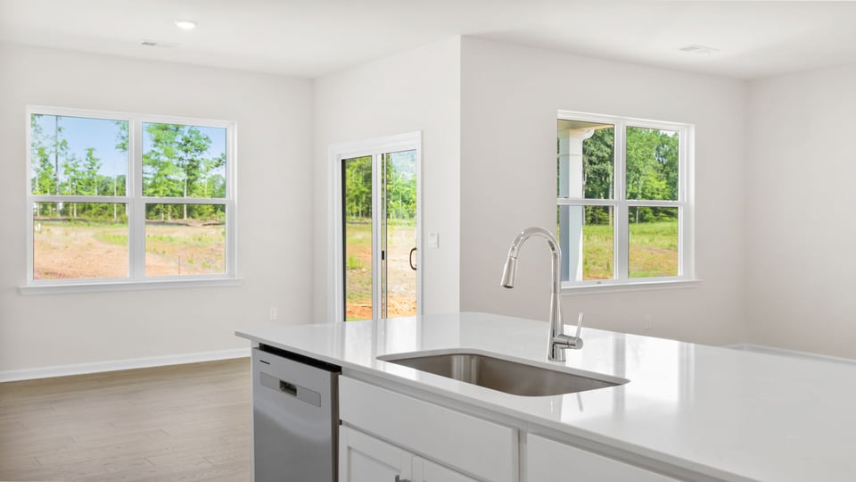 Kitchen with island and cabinets.