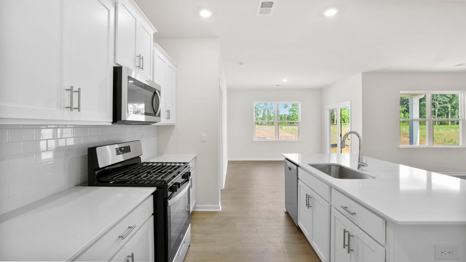 Kitchen with island and cabinets.
