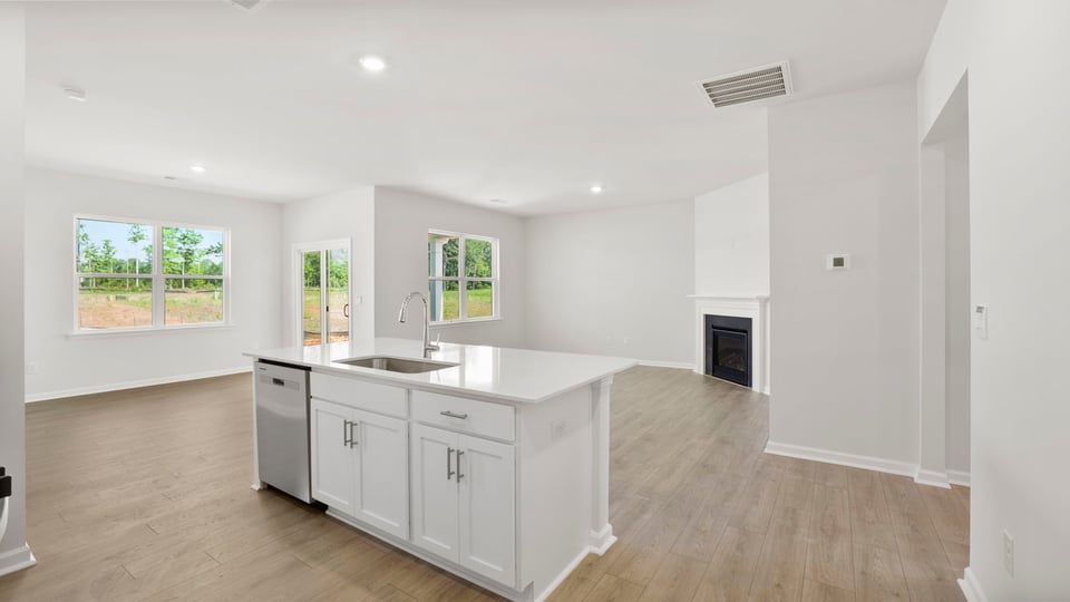 Kitchen with island and cabinets.