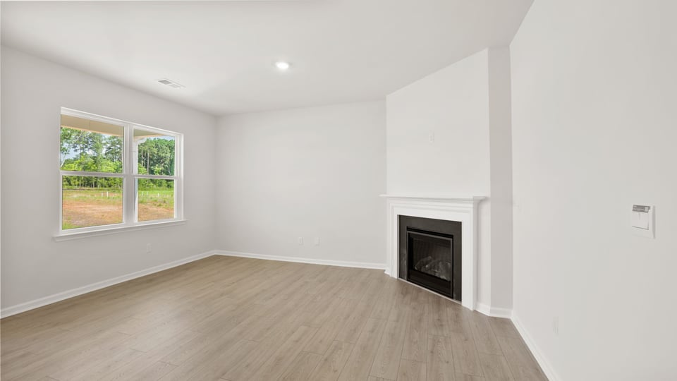 Living area with windows and fireplace.