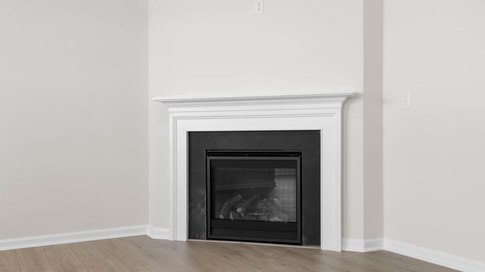 Living area with windows and fireplace.