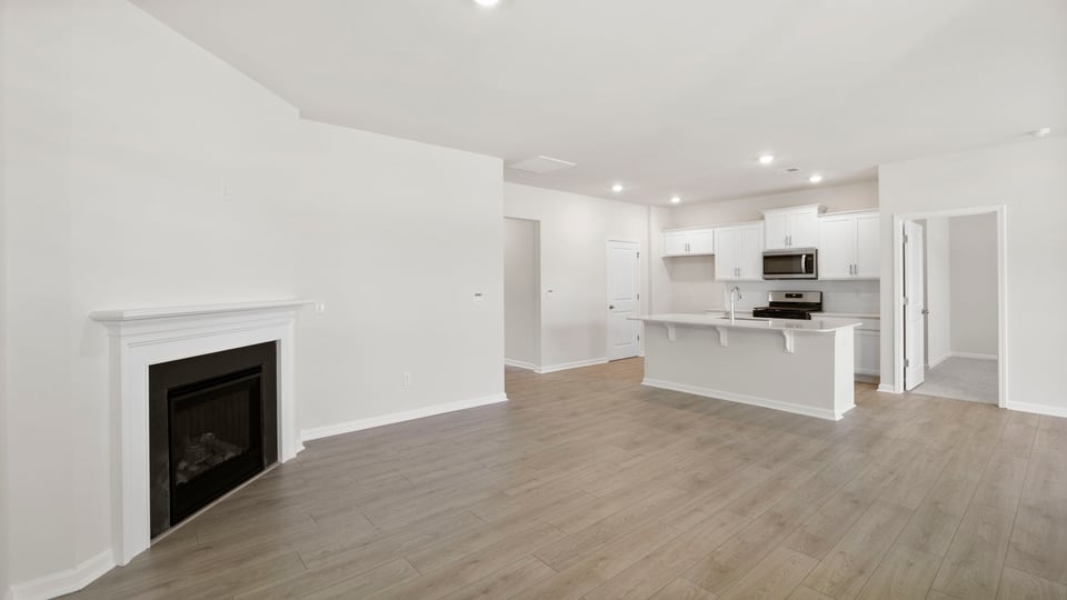 Living area with windows and fireplace.