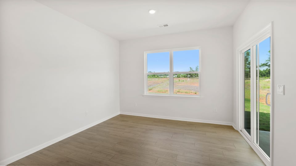Living area with windows and fireplace.