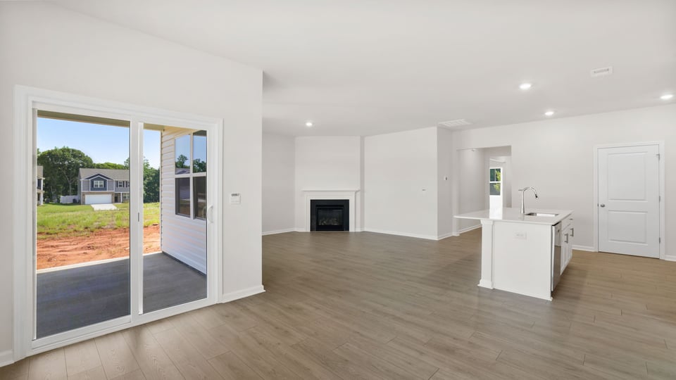 Living area with windows and fireplace.