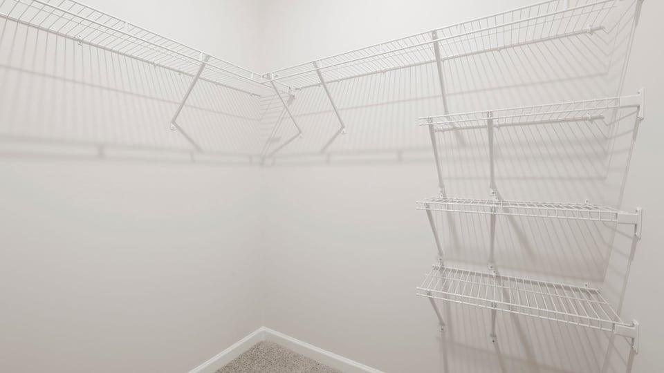Primary closet with shelf.