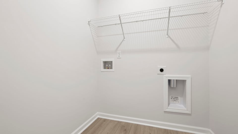 Laundry room with shelf.