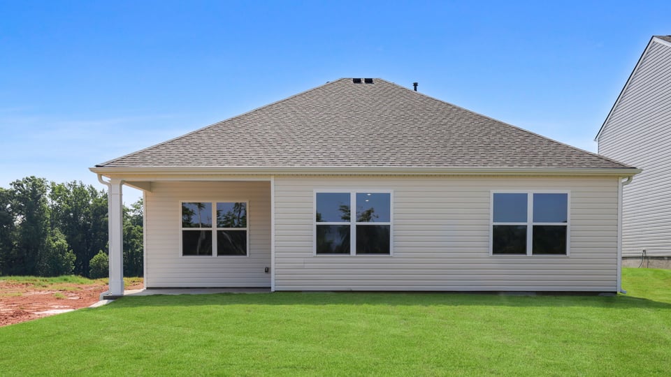 Back exterior with large backyard.