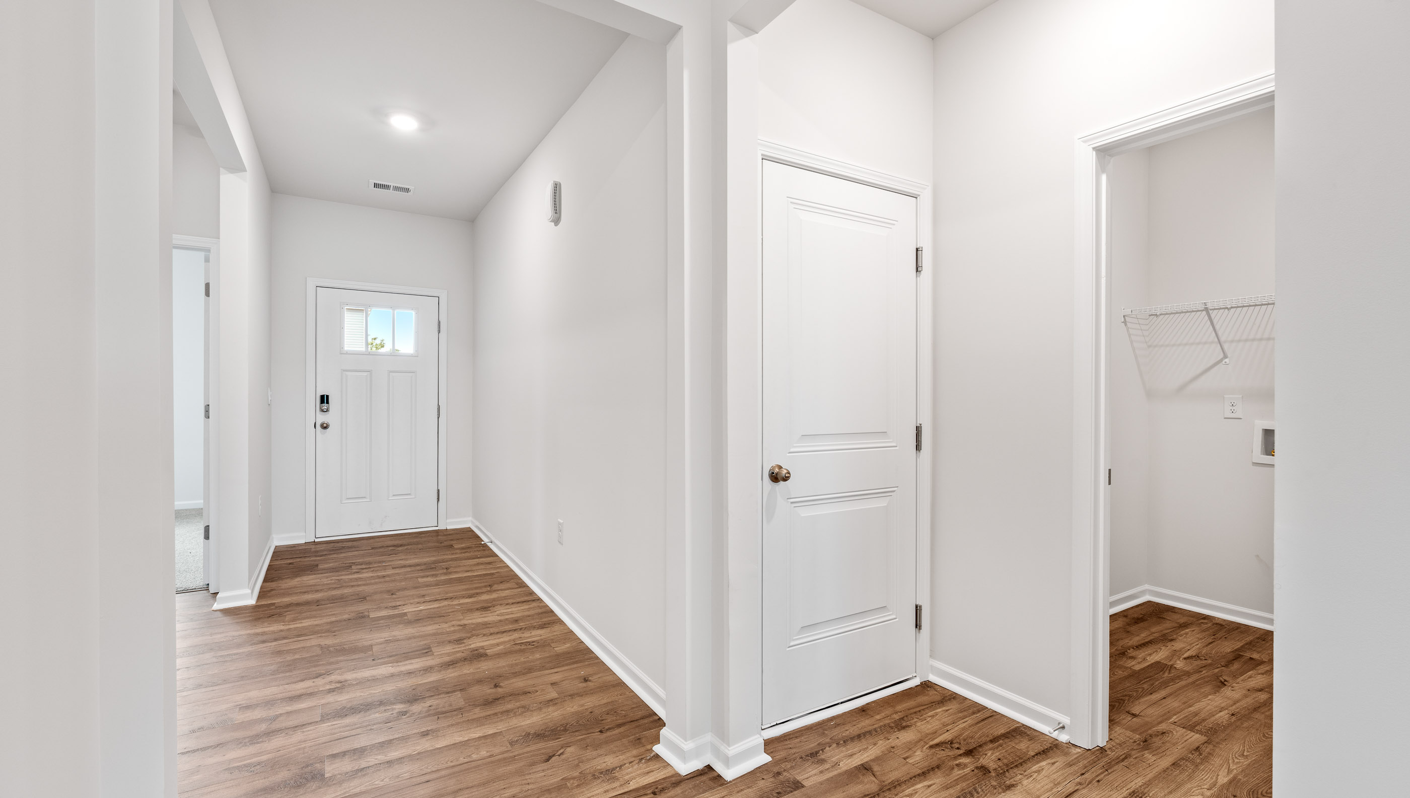 View of foyer and location of the laundry room.