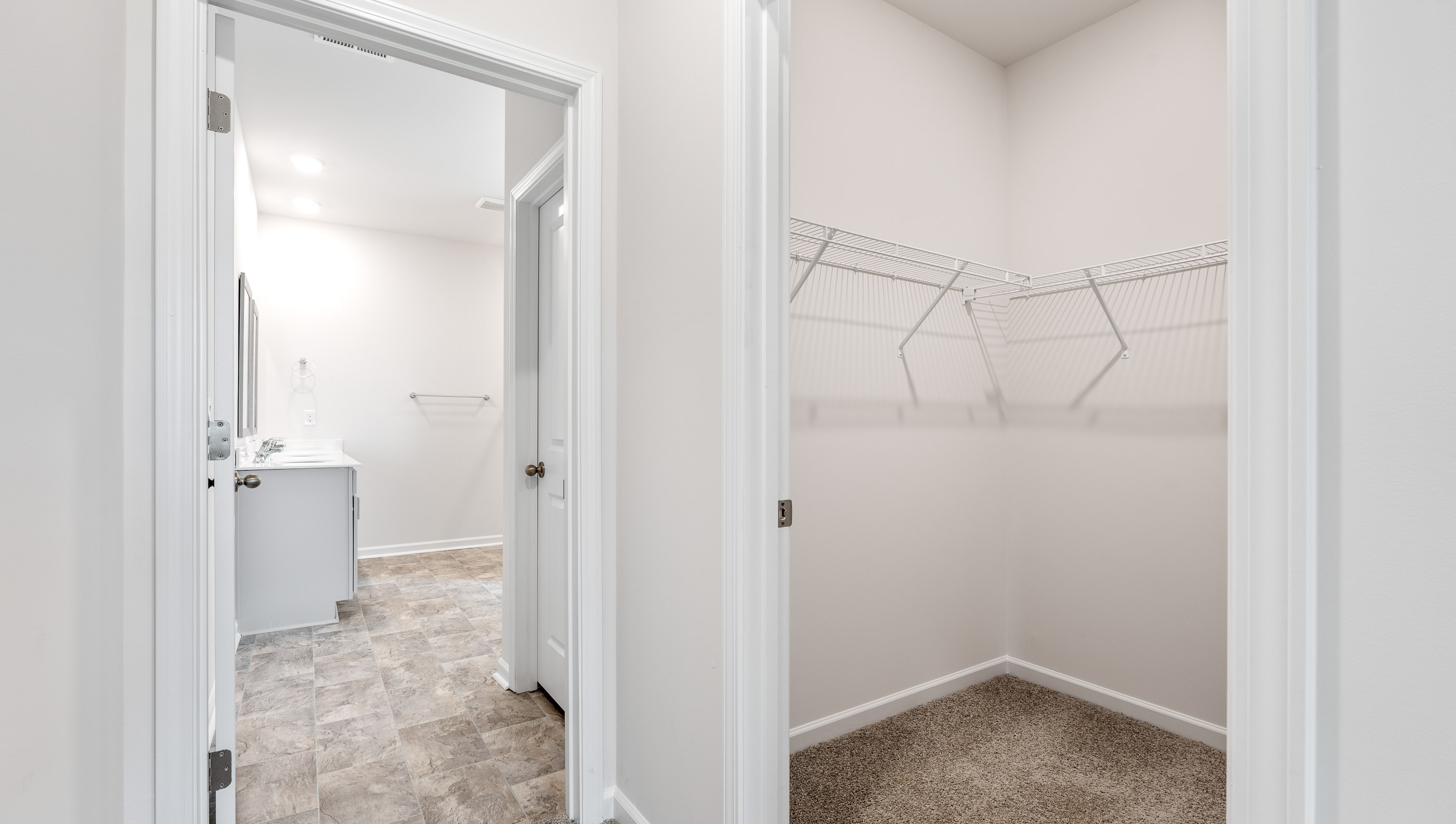 Primary bedroom walk-in closet.