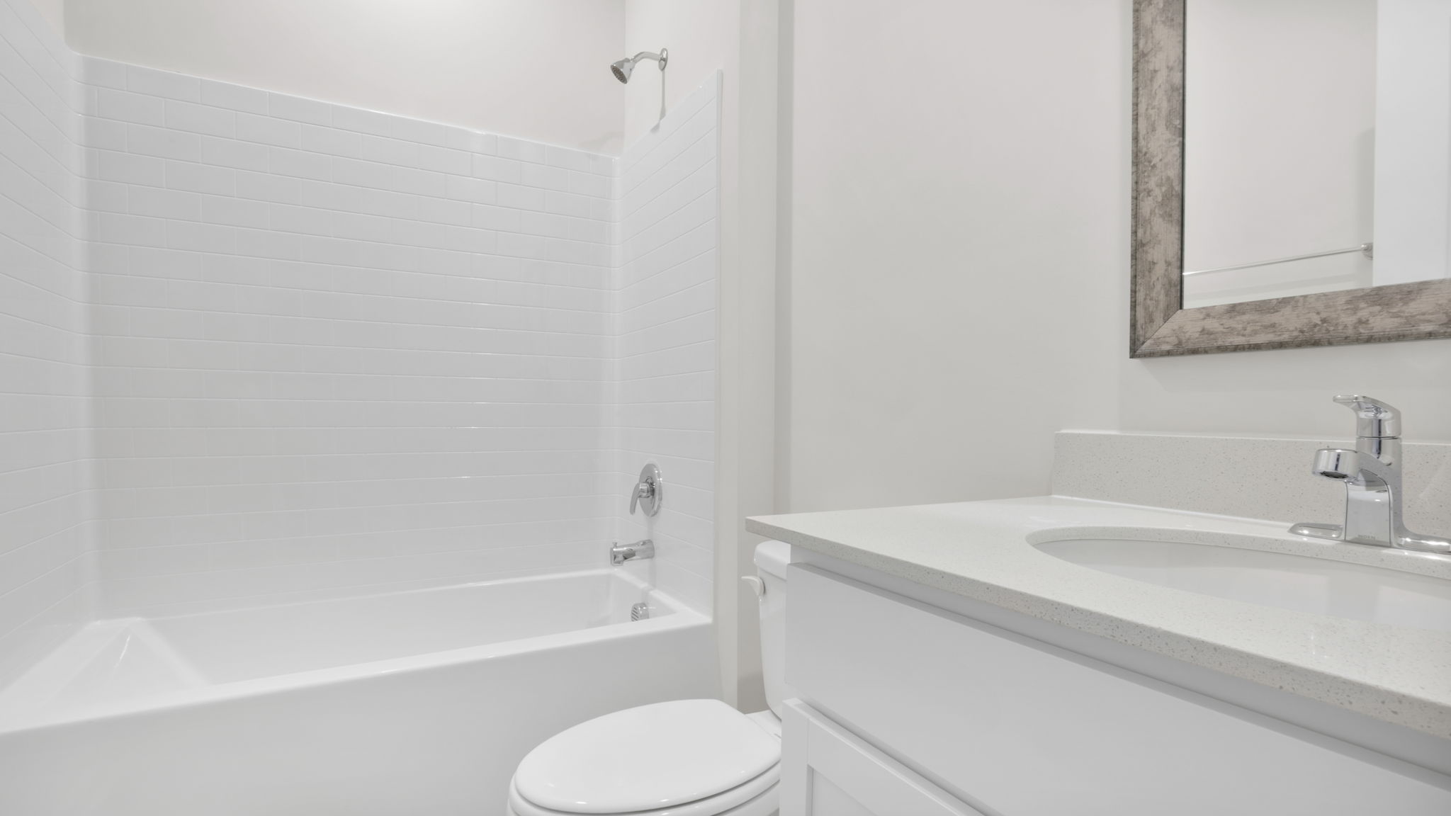 Bathroom with single vanity sink and tub.