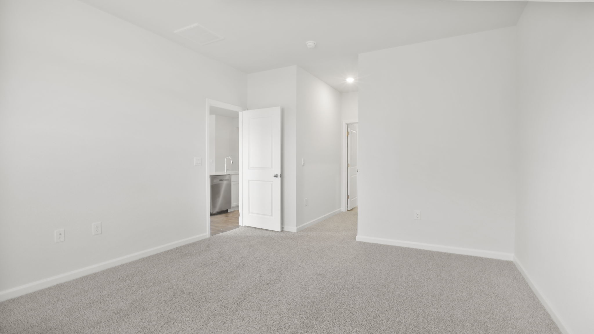 Bedroom with carpet and window.