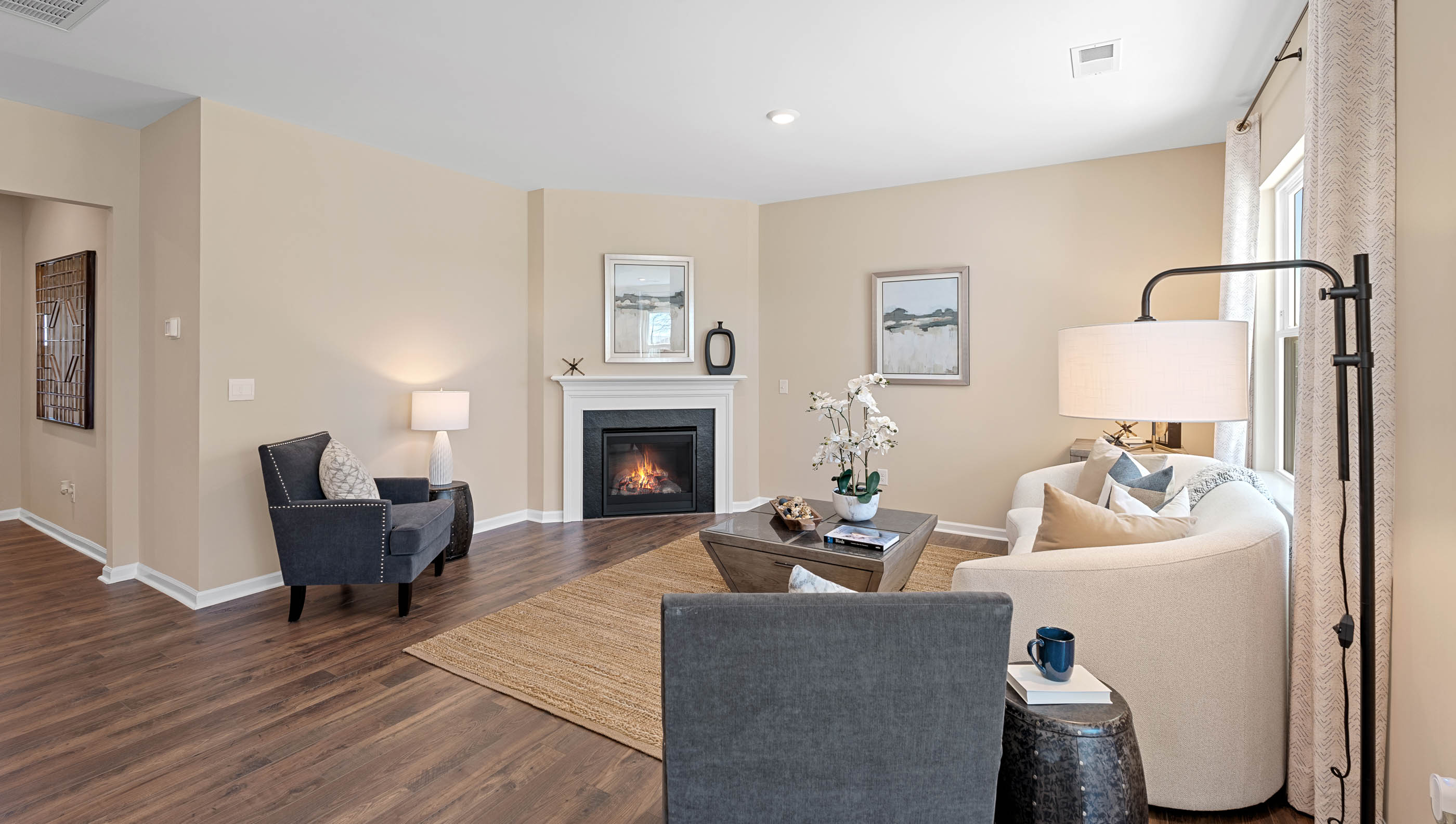Living area with fireplace and windows.