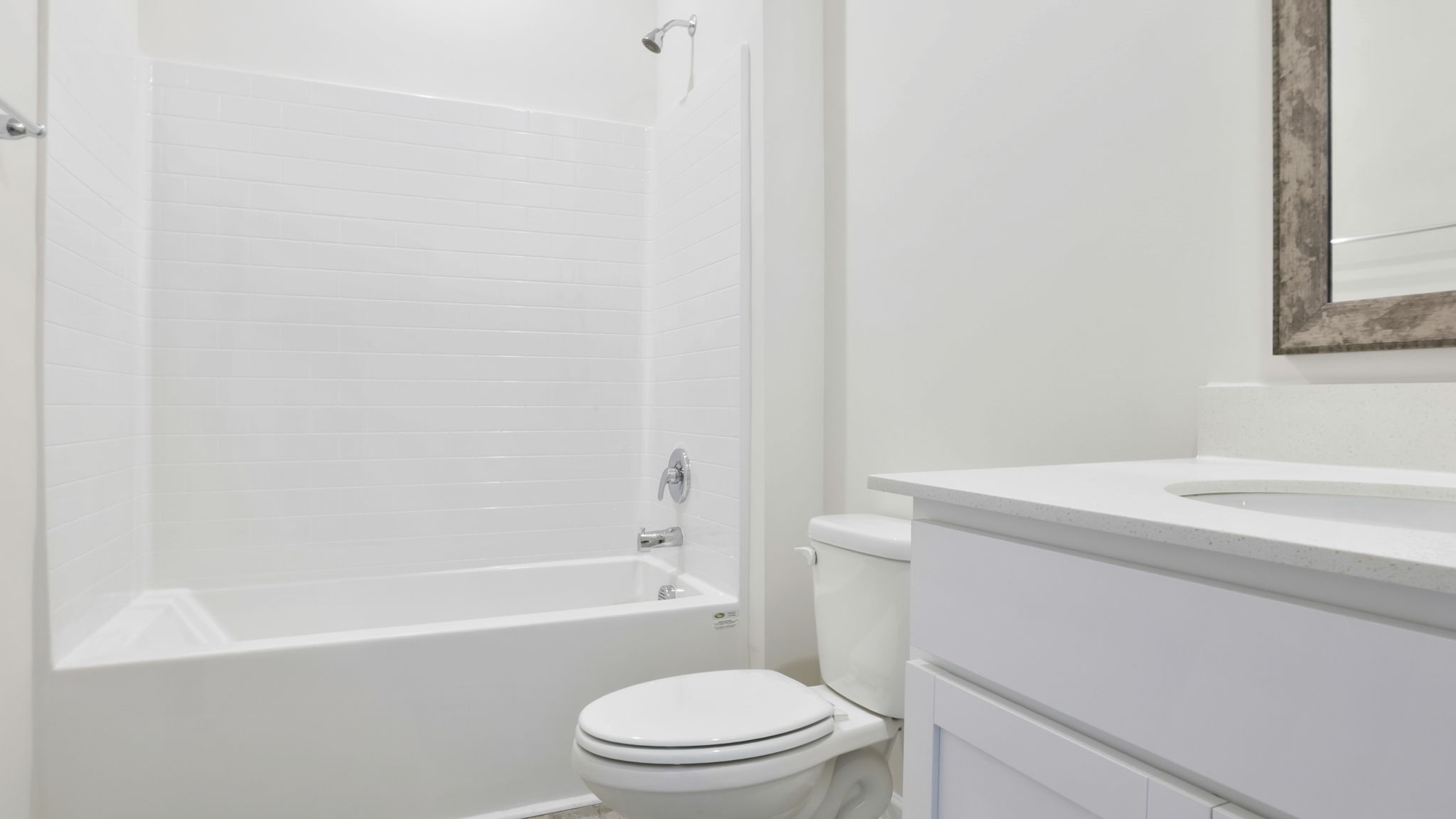 Bathroom with tub and single vanity sink.
