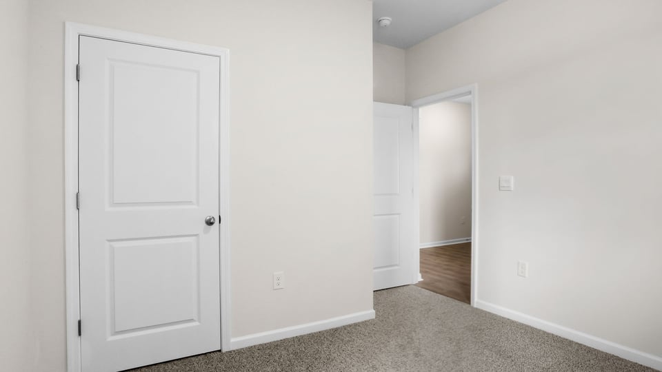 Bedroom with carpet and window