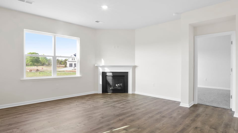 Living area with windows and fireplace.