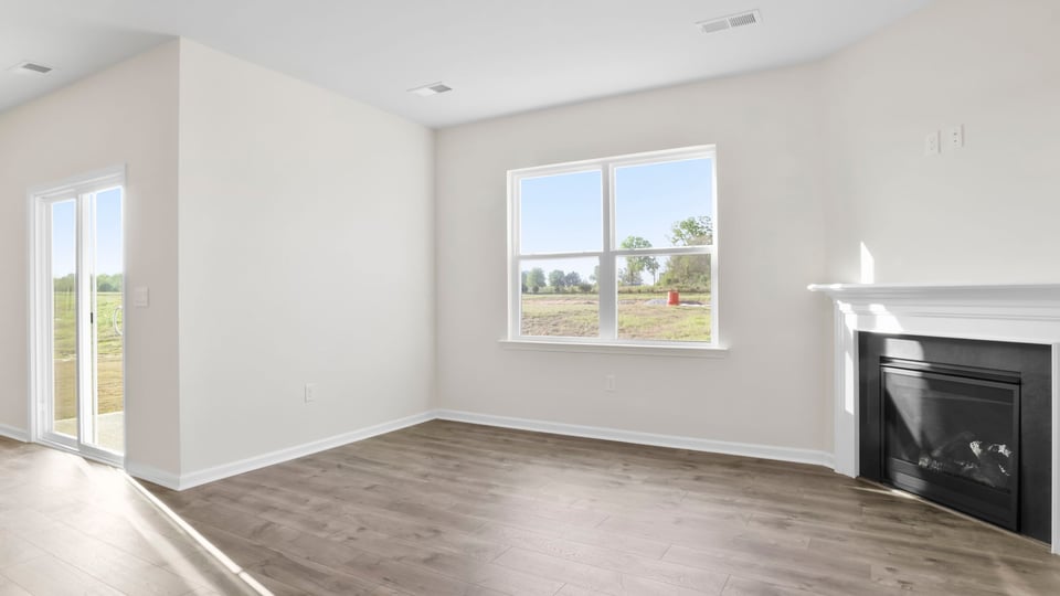 Living area with windows and fireplace.