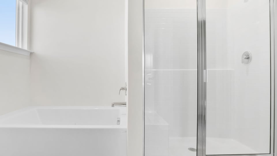Primary bathroom with double vanity sinks.