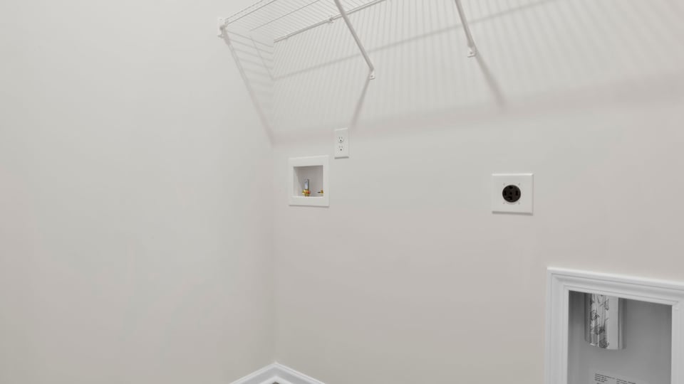 Laundry room with shelf.