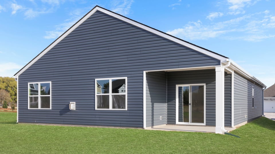 Back exterior with large backyard.