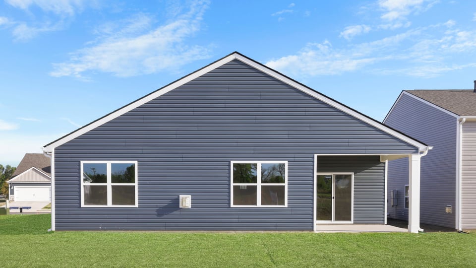 Back exterior with large backyard.