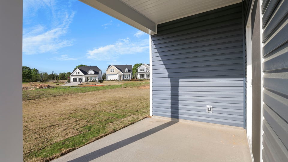 Back exterior with large backyard.