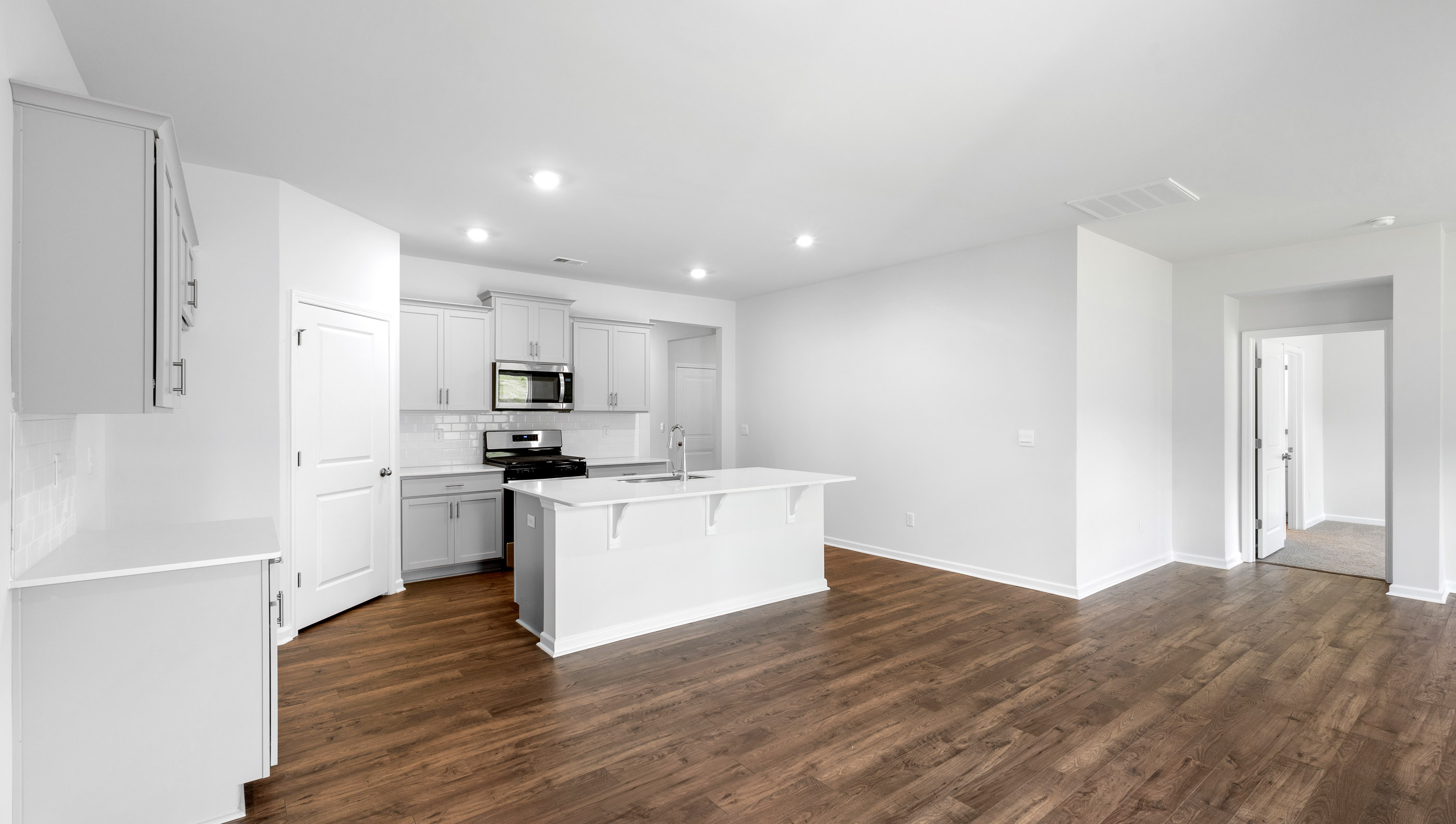 Kitchen with island and cabinets.