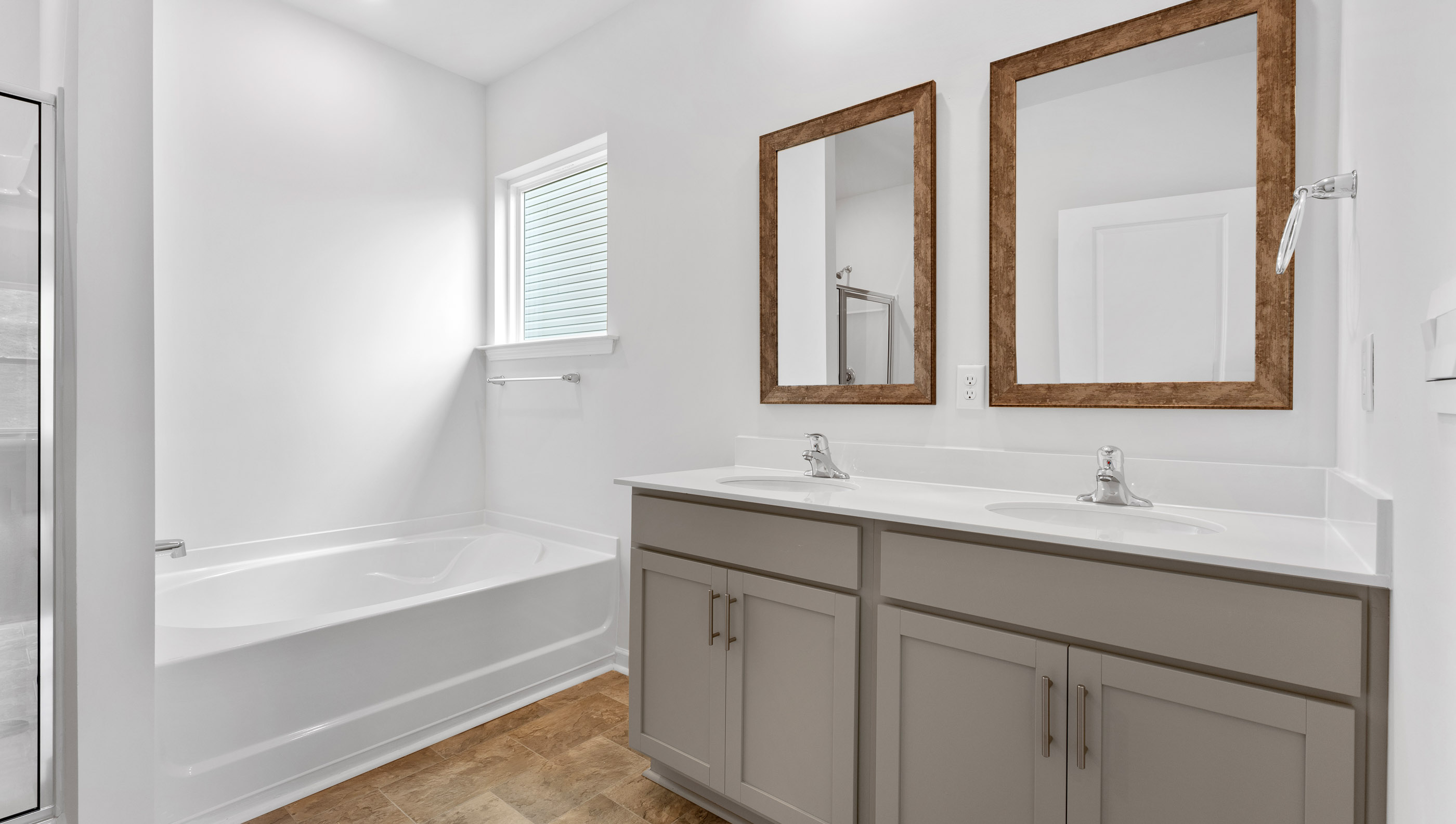 Primary bathroom with double vanity sinks.