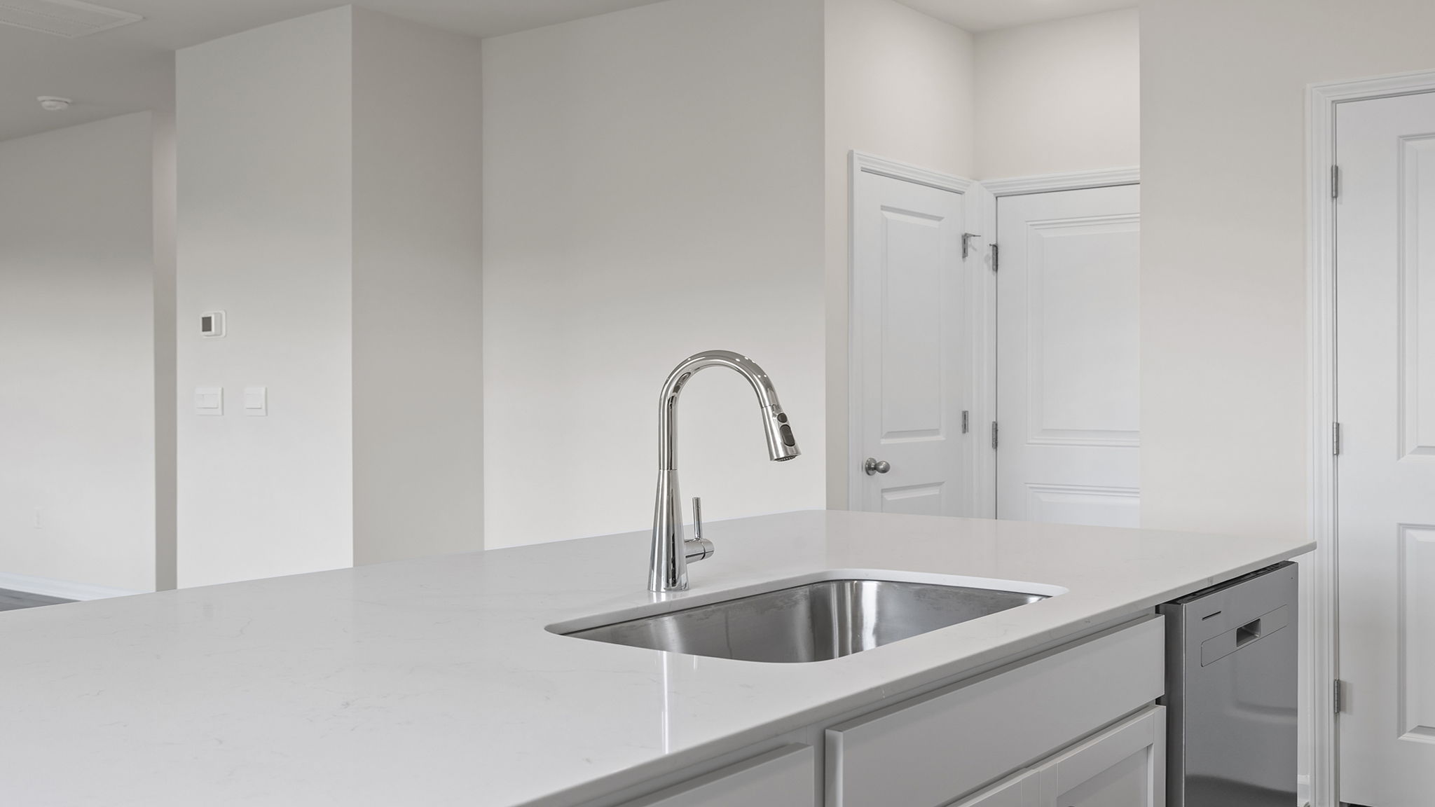 Kitchen with island and cabinets.