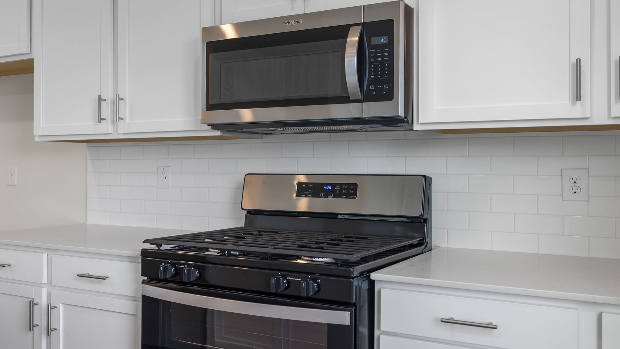 Kitchen with island and cabinets.