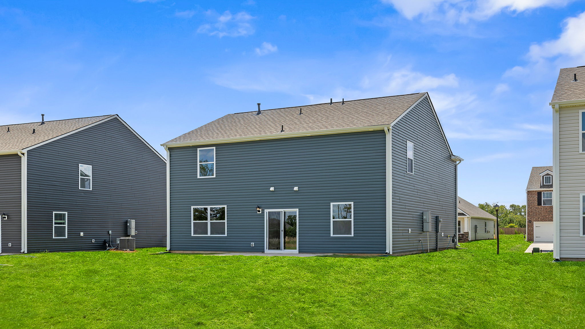 Back exterior with large backyard.