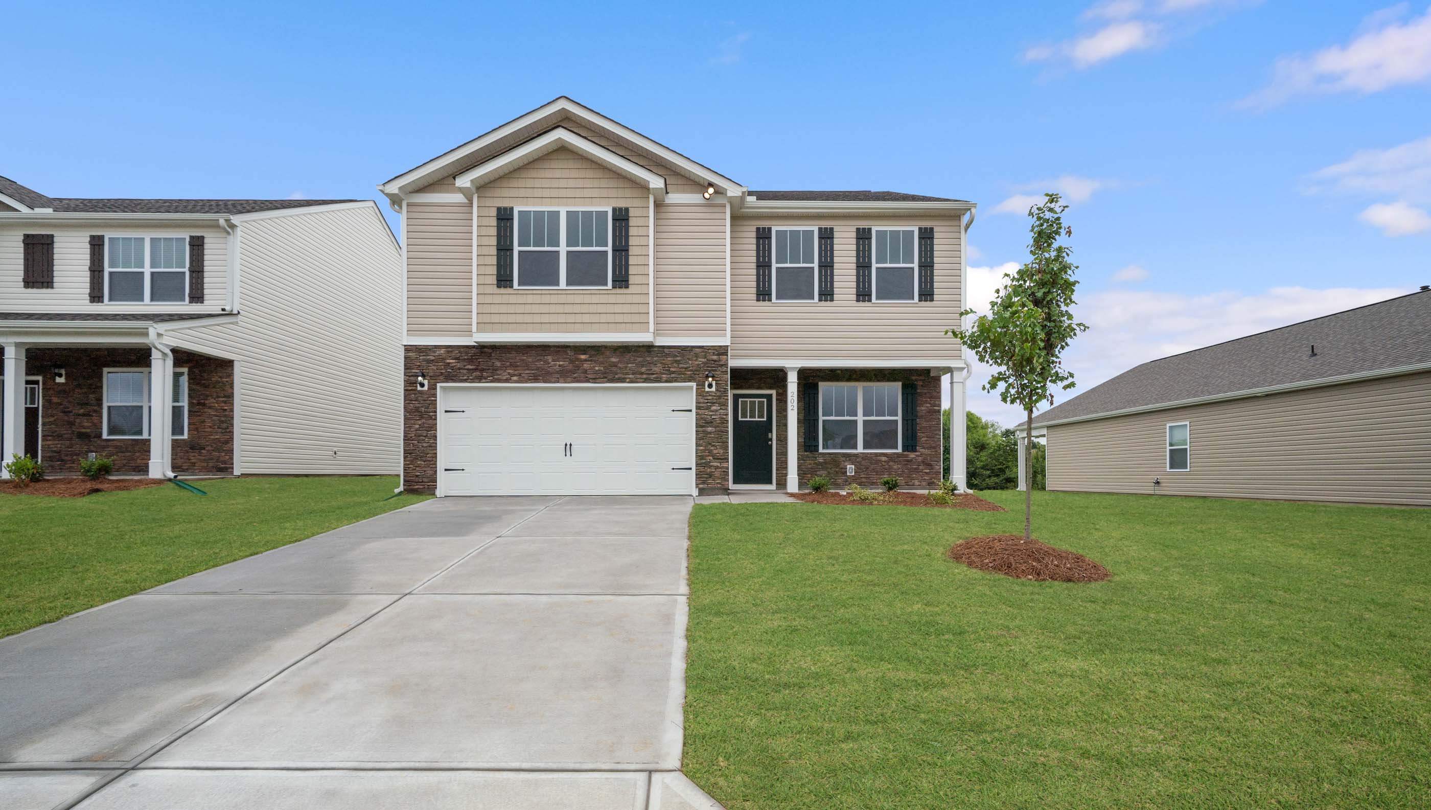 Front exterior of Penwell with 2 car garage.