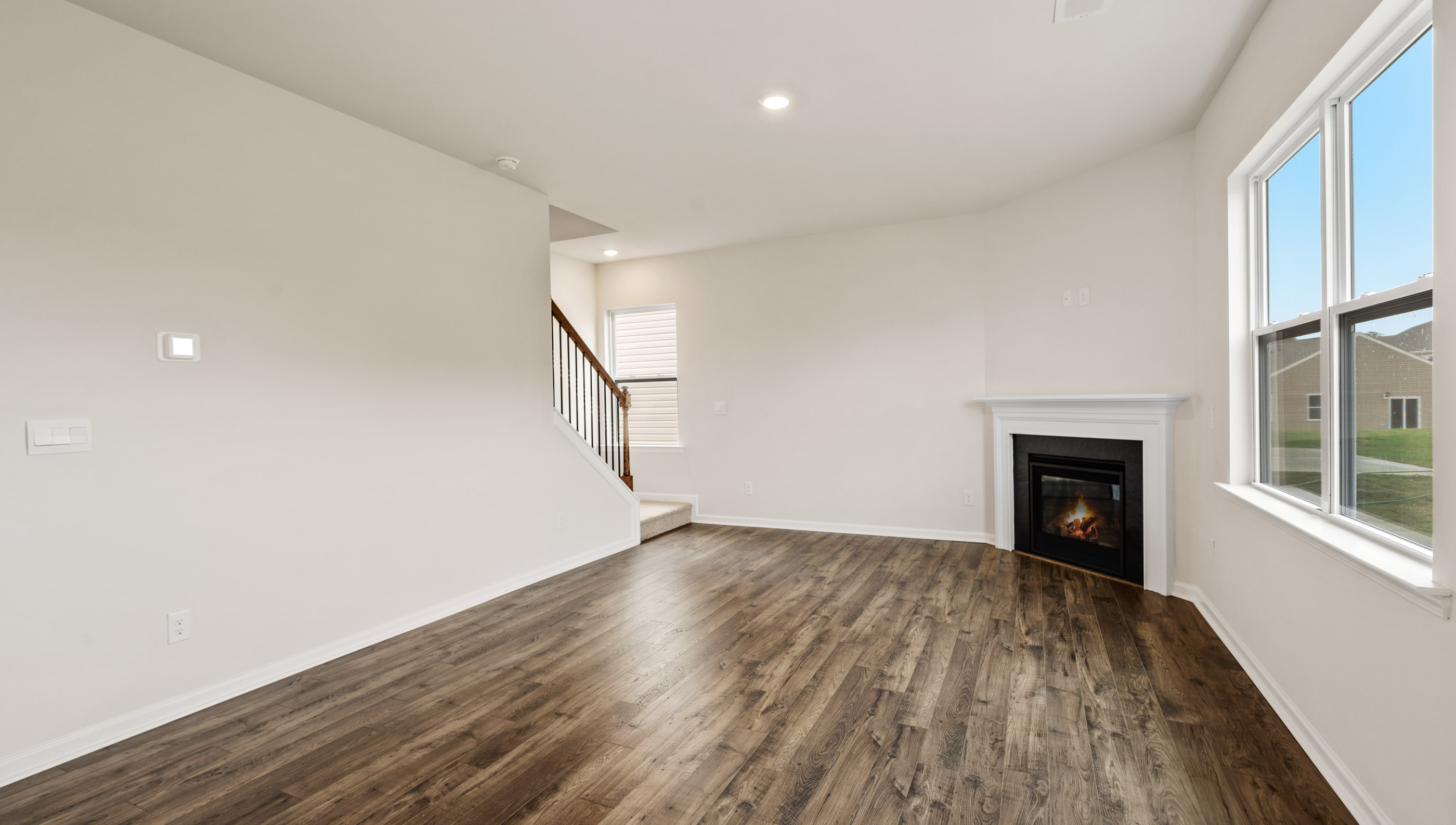 Family room with fireplace and window.