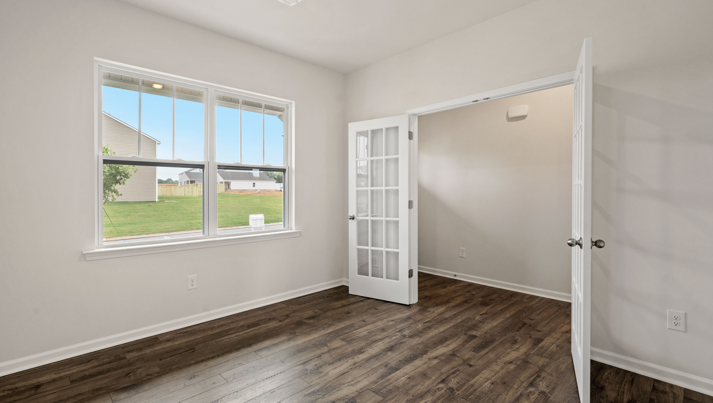 Study located at front of home with window.