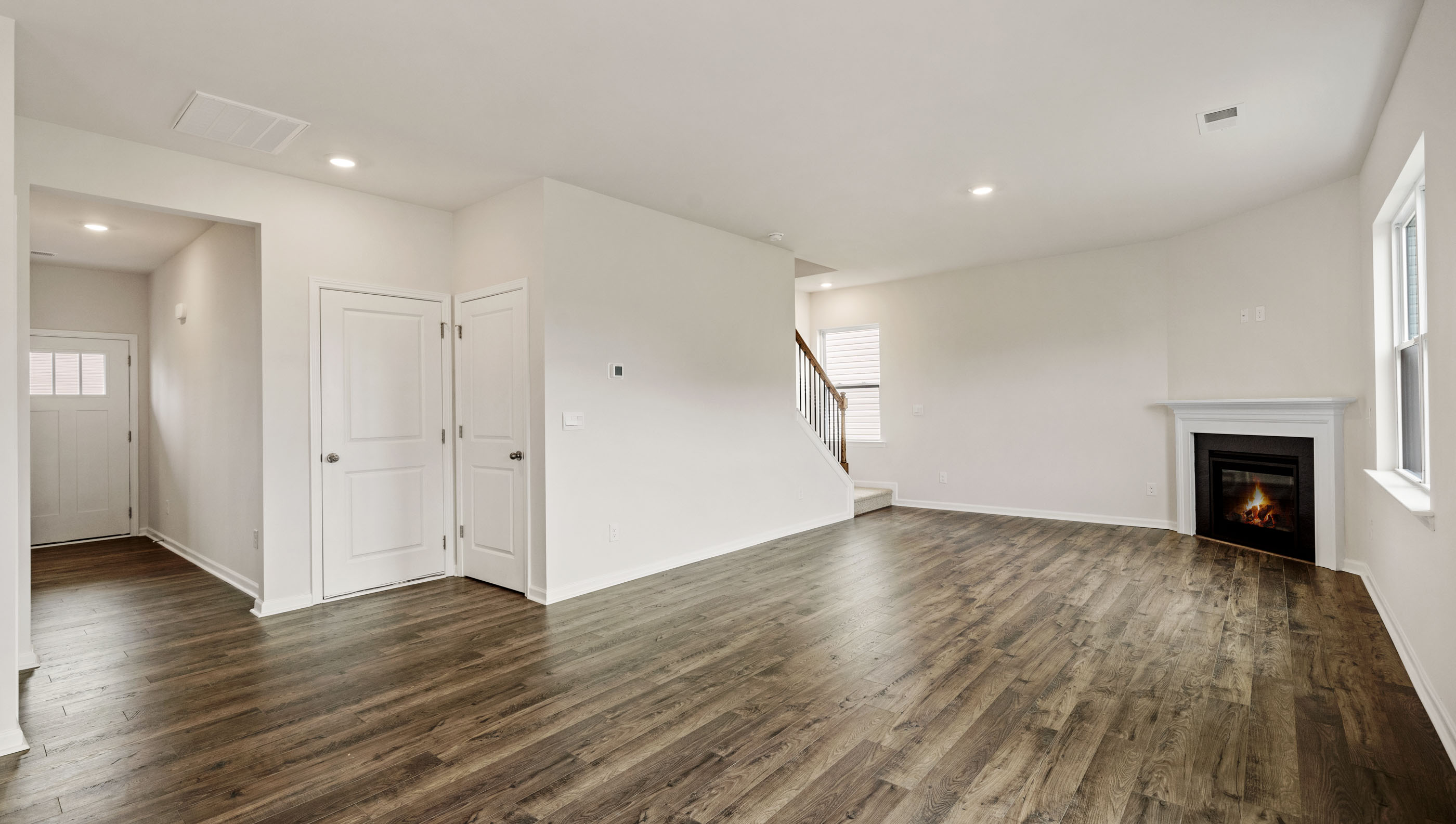 View of family room and hallway to the entrance.