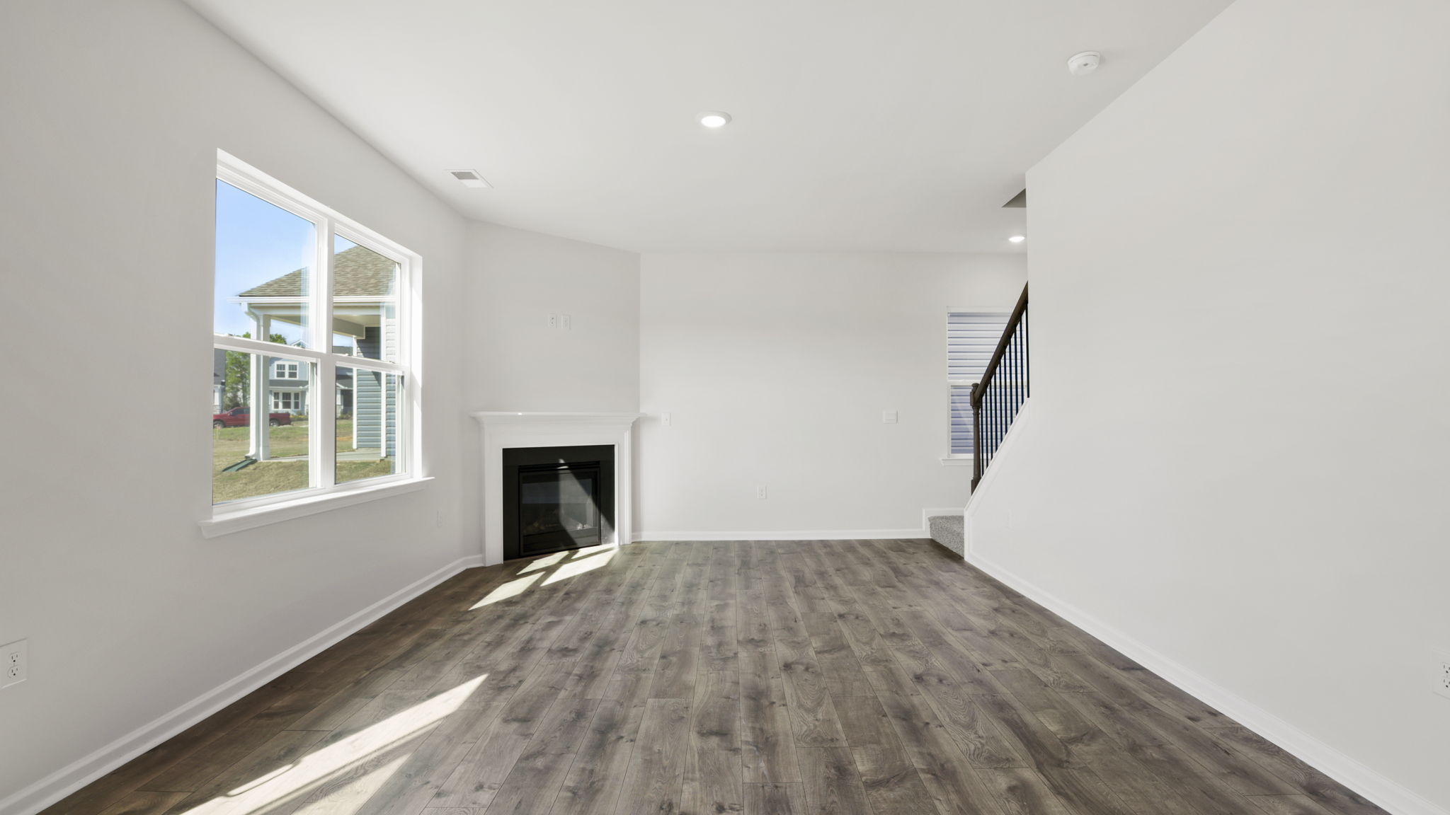 Family room with windows and fireplace.