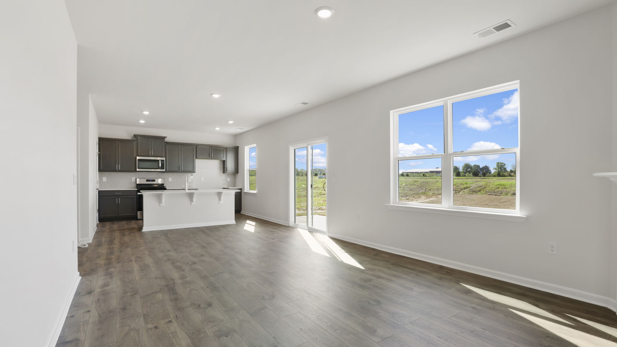 Family room with windows and fireplace.