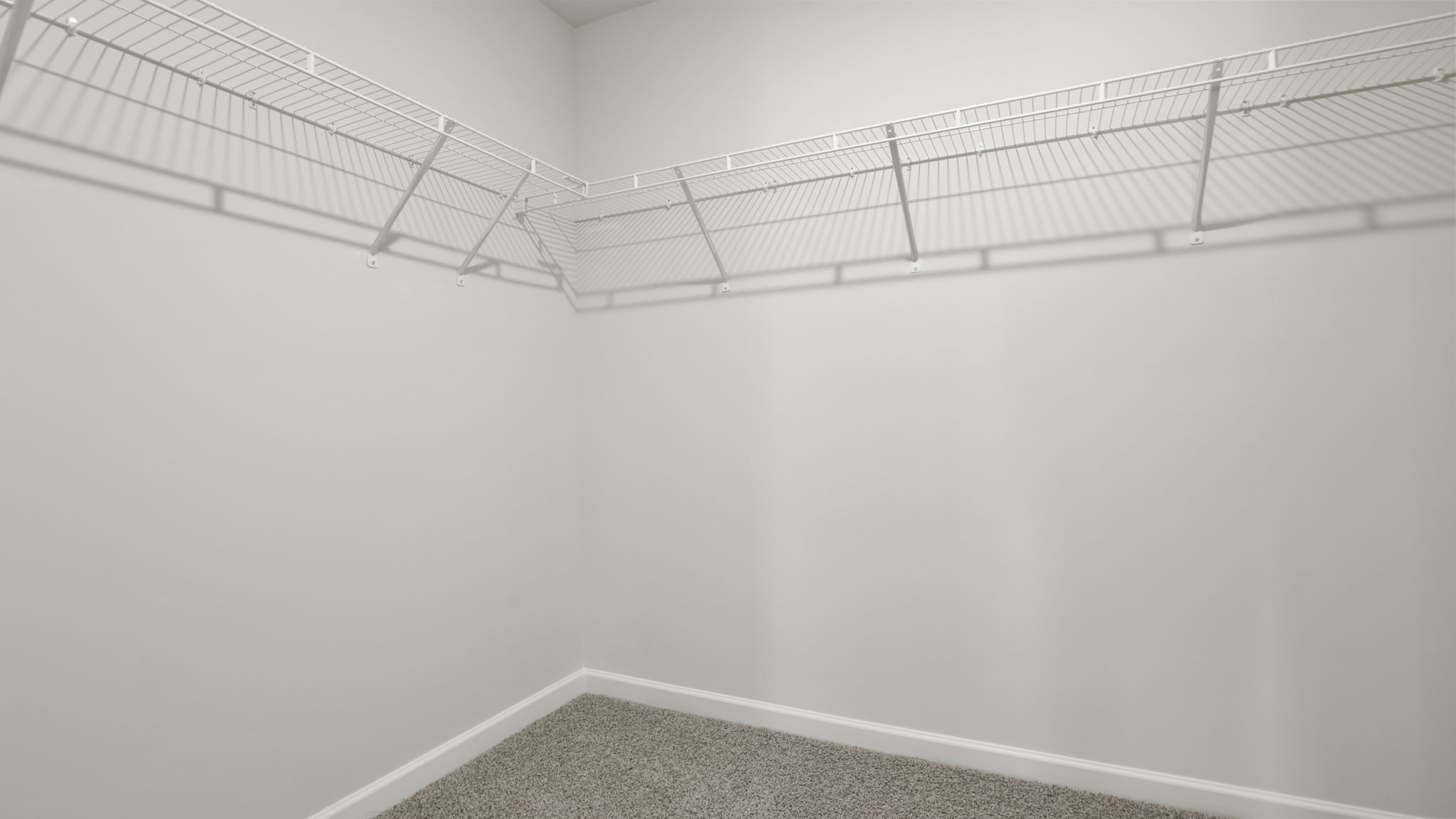 Closet with hanging storage racks.