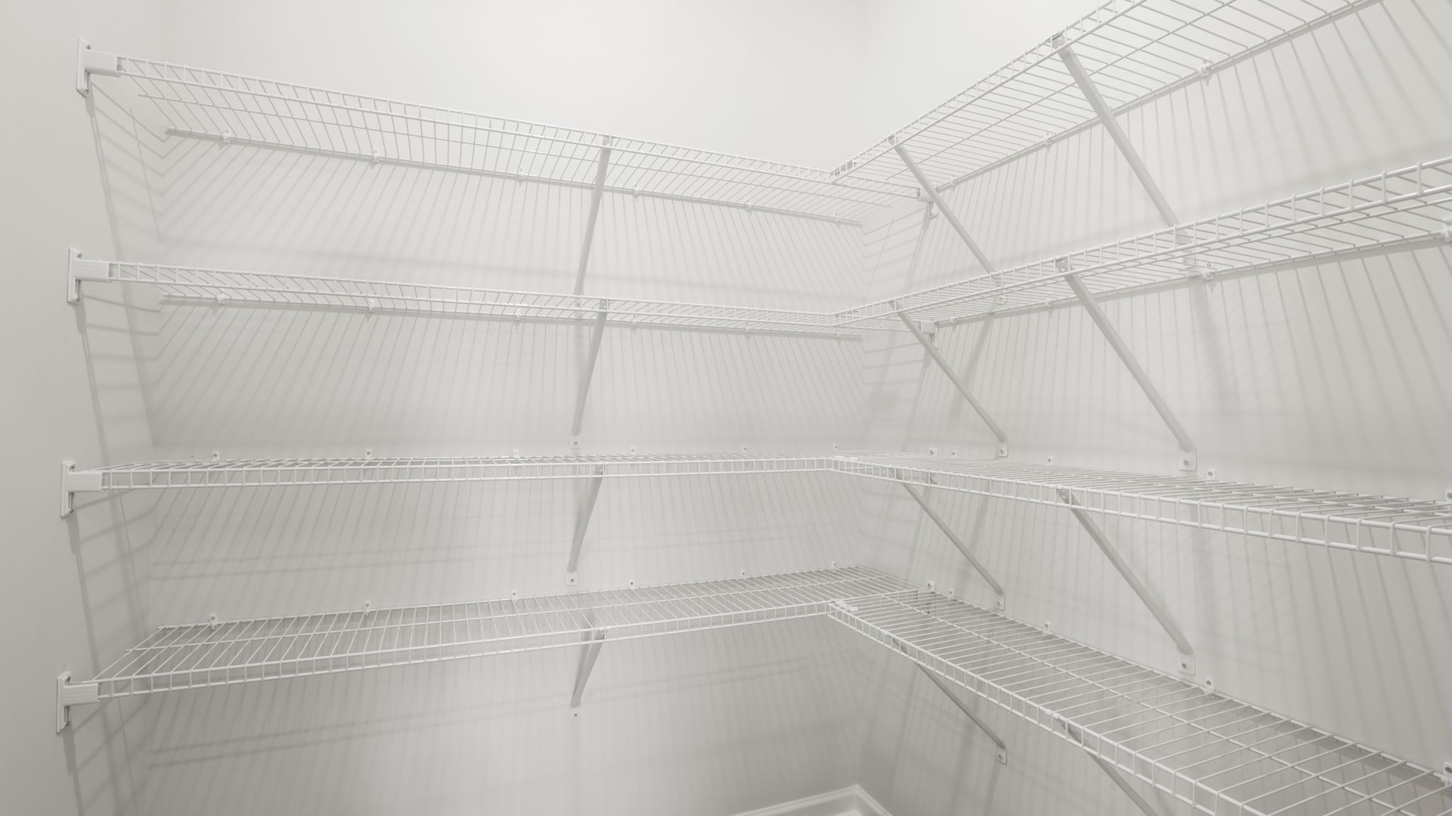 Closet with hanging storage racks.