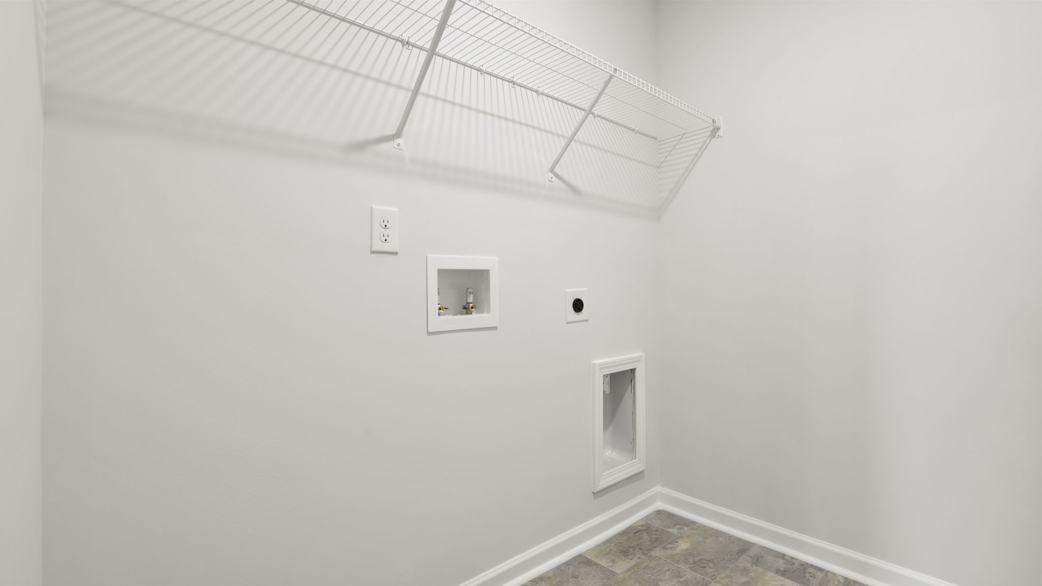 Laundry room with hanging storage racks.
