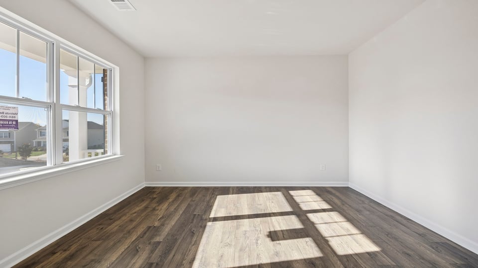 Study located at front of home with window.