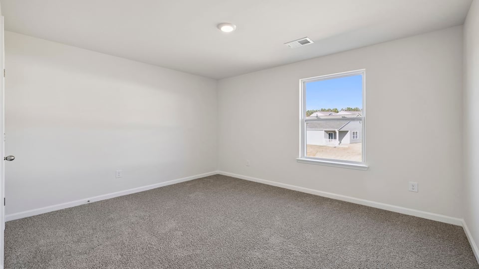 Loft area with window and carpet.