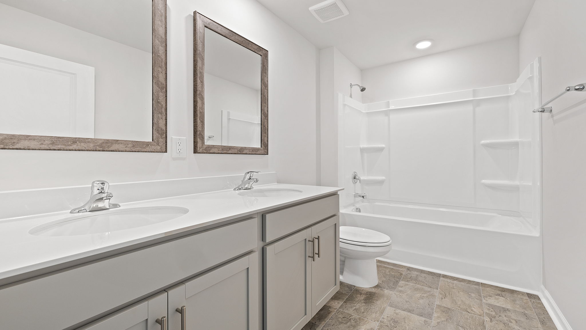 Primary bathroom with double vanity sinks.