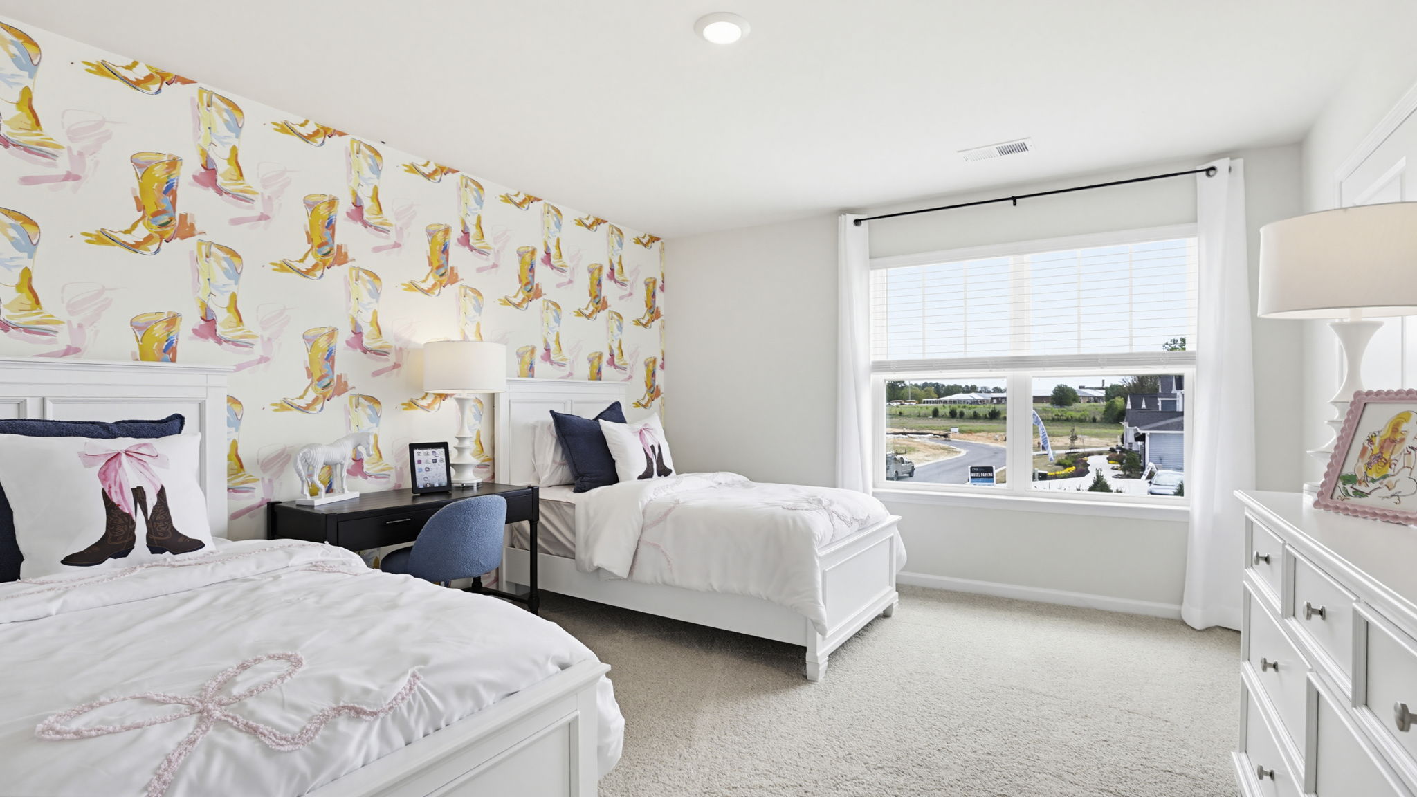 Bedroom with carpet and window.