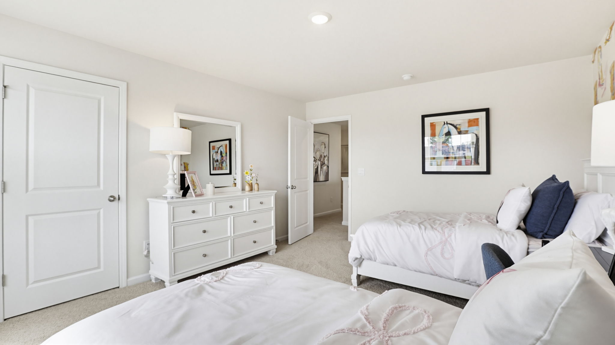 Bedroom with carpet and window.