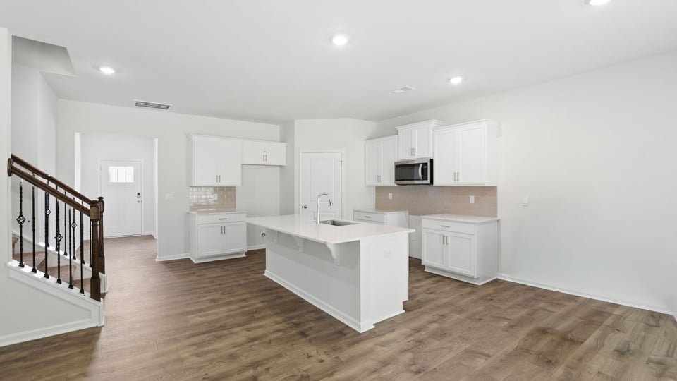 Kitchen with island and cabinets.