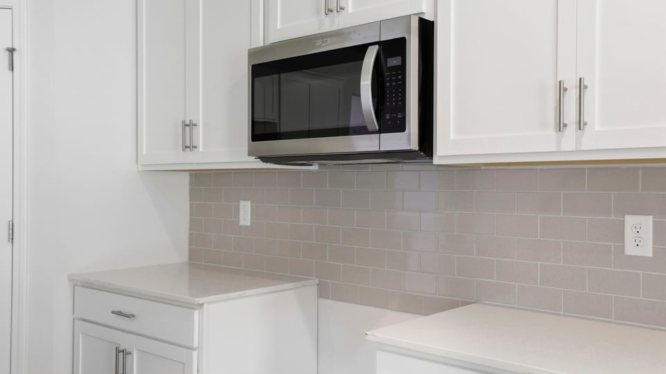 Kitchen with island and cabinets.