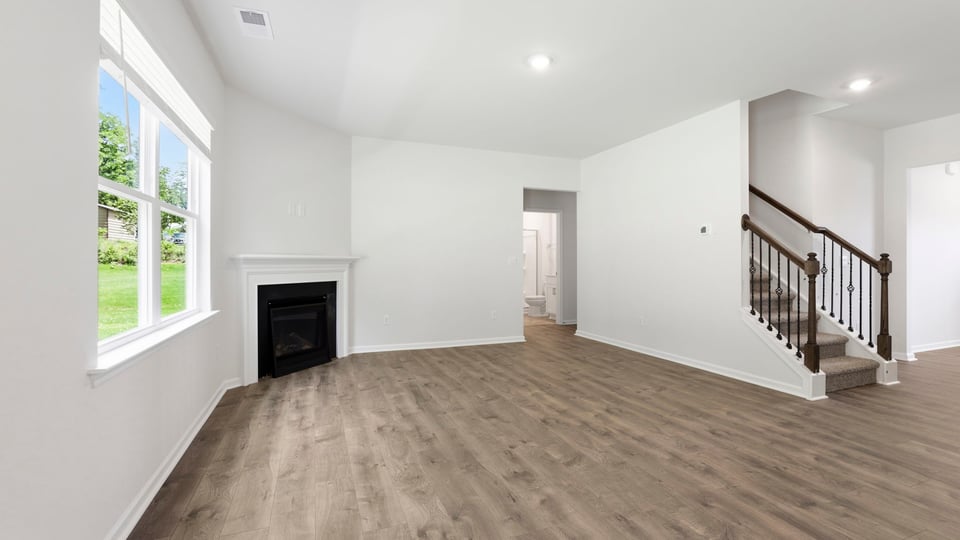 Living area with windows and fireplace.